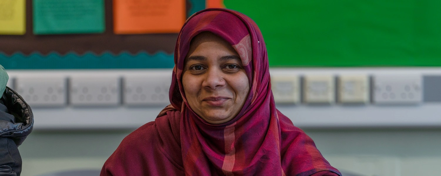 Mature student looks at camera